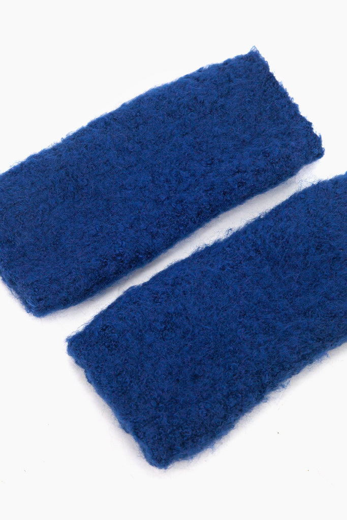 side view of the knitted wrist warmers, showing the opening at each end