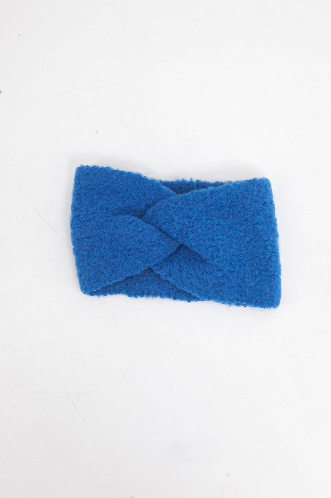 knitted royal blue twist front head band laying flat