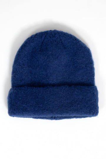 navy blue textured knitted beanie hat with a foldable brim