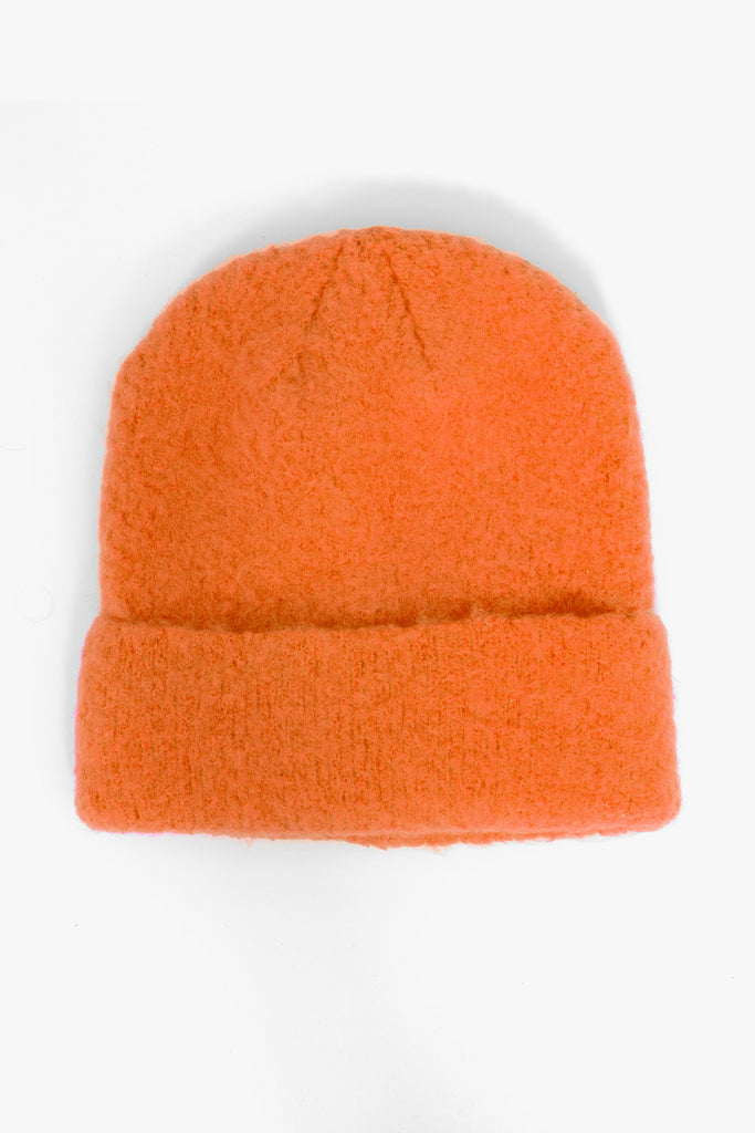 orange textured knitted beanie hat with a foldable brim