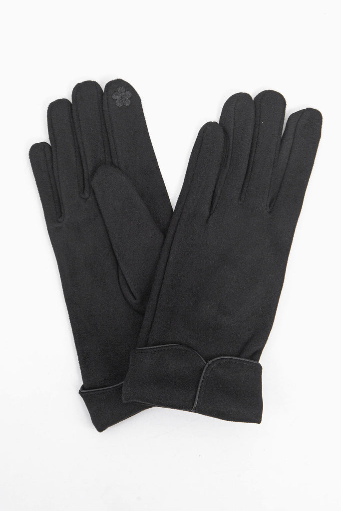 a close up of the black faux velvet winter gloves showing up close scalloped cuffs.