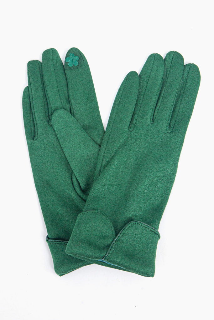 a close up of the green faux velvet winter gloves showing up close scalloped cuffs.