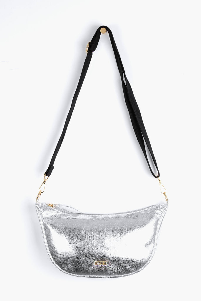 faux cracked leather metallic silver half moon crossbody bag with a black canvas detachable strap