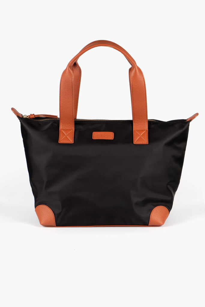 black tote bag with brown tan accents and a brown carry handle, the bag has an external zip closure fastening on the top