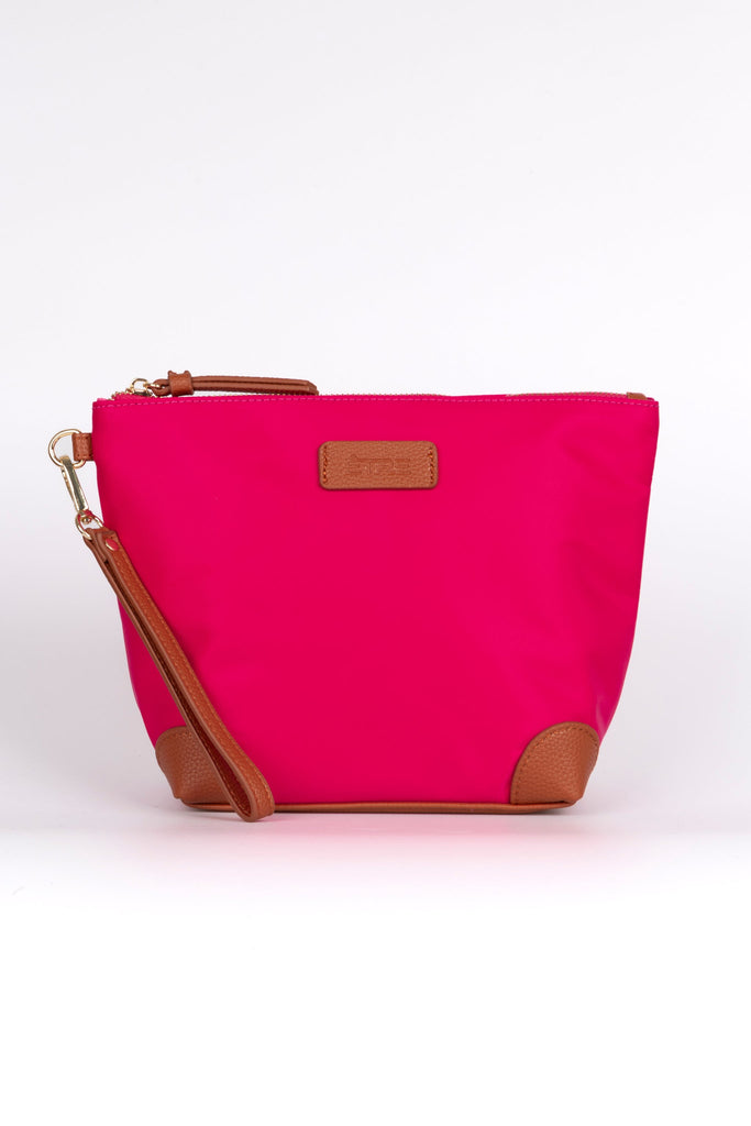 bright pink vanity bag with tan pleater accents and detachable wrist strap