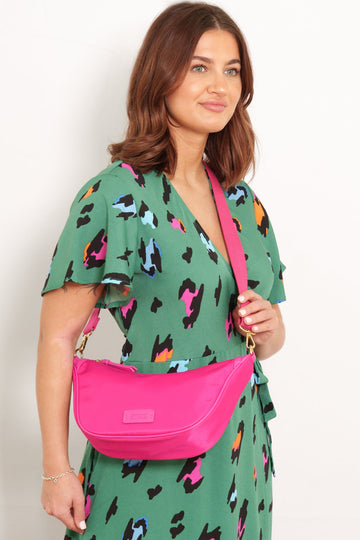 Quinn-Half-Moon- Crossbody-Bag - Pink-Nylon-PU-On-Model-Styled-With-Green-Dress