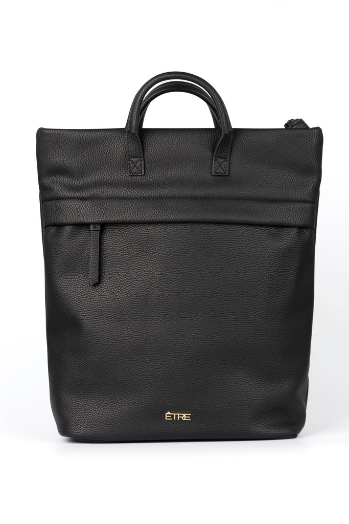 plain black back pack with top handles and a zip closure, the bag is made from faux leather PU