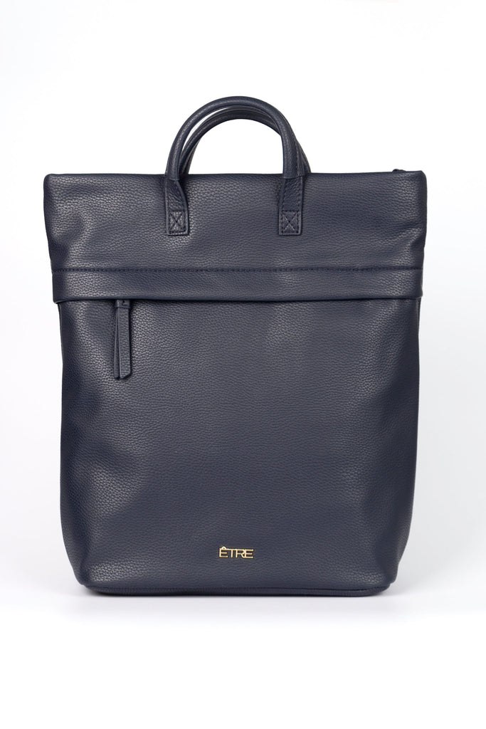 plain navy blue back pack with top handles and a zip closure, the bag is made from faux leather PU