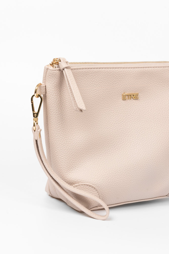 sylvie-vanity-bag-nude-pebbled-faux-leather-close-up-strap-zip