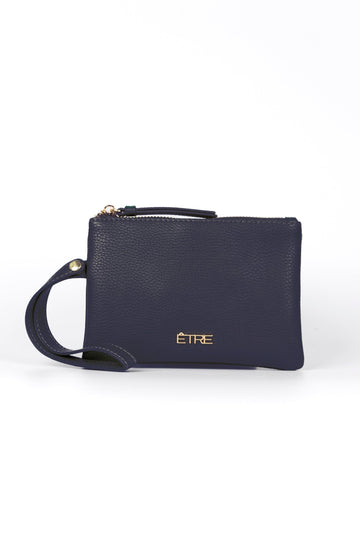 navy blue faux leather purse with a wristlet strap and zip closure