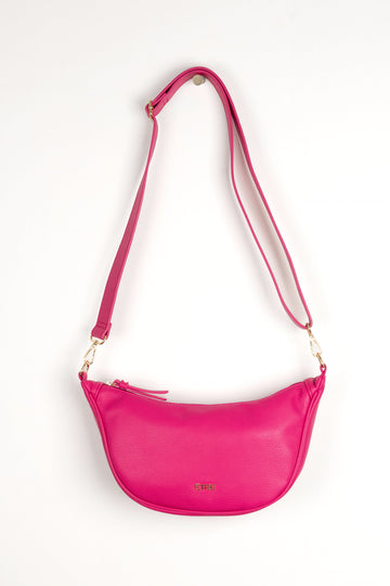 fuchsia pink faux leather crossbody half moon sling bag with detachable bag strap