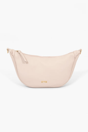 stevie-half-moon-crossbody-bag-nude-pebbled-faux-leather-front-view-gold-etre-logo