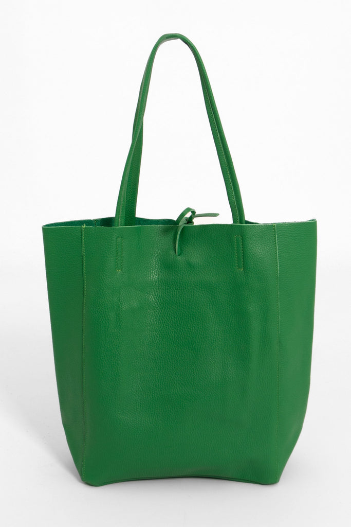 showing the back of the green leather tote bag, the pebbled texture of the leather is visible