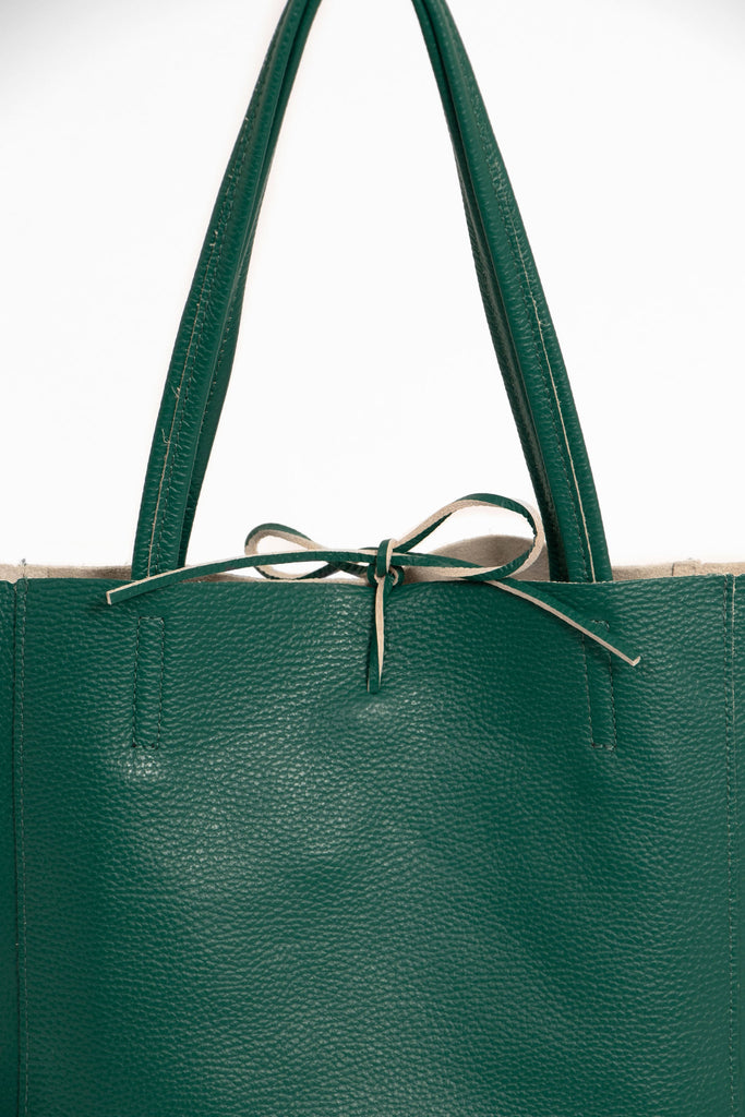 close up of the top tie fastening on the emerald green leather tote bag