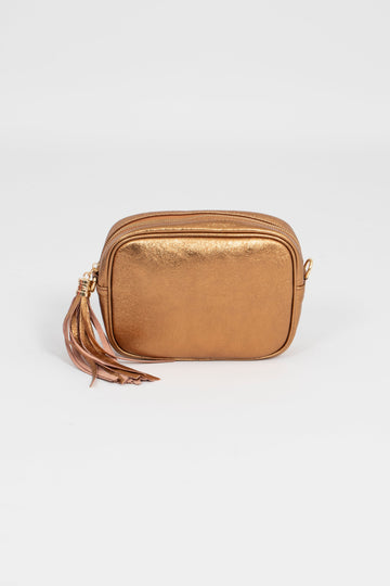 metallic bronze leather crossbody camera bag with a detachable strap and gold hardware