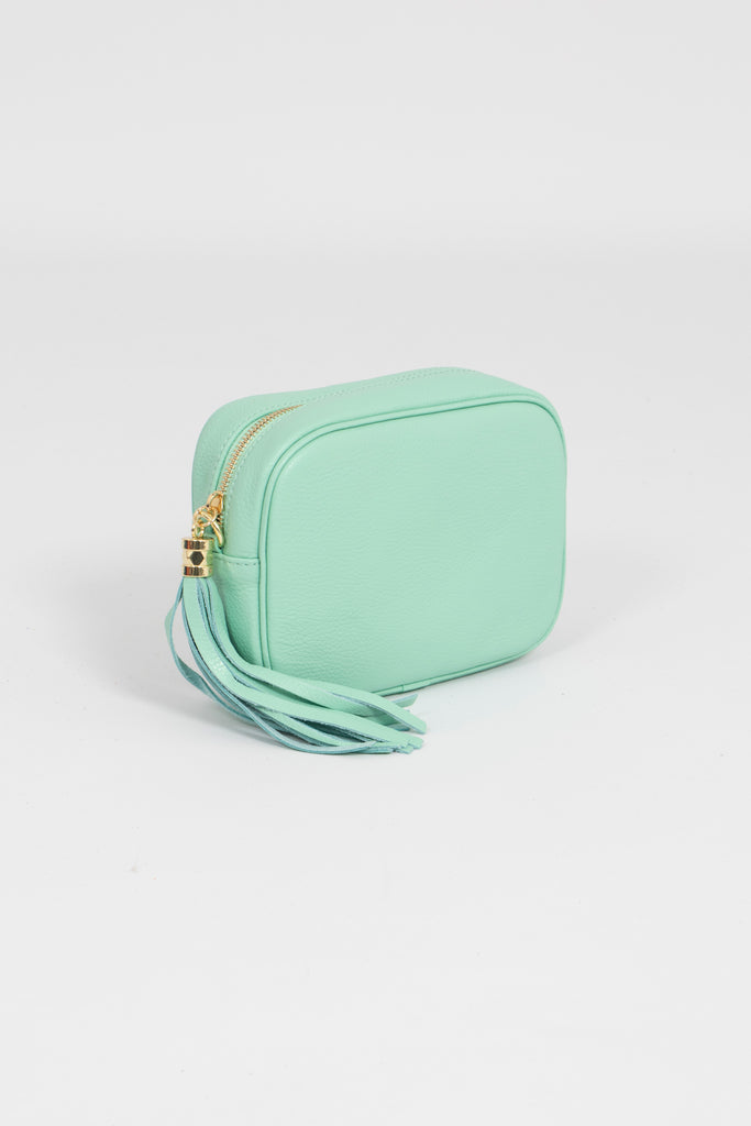 beau-italian-leather-crossbody-bag-light-green-pebbled-side-on-close-up-tassel