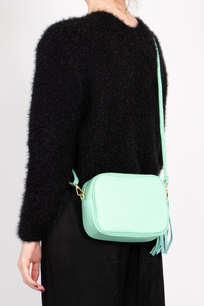 beau-italian-leather-crossbody-bag-light-green-pebbled-worn-by-model