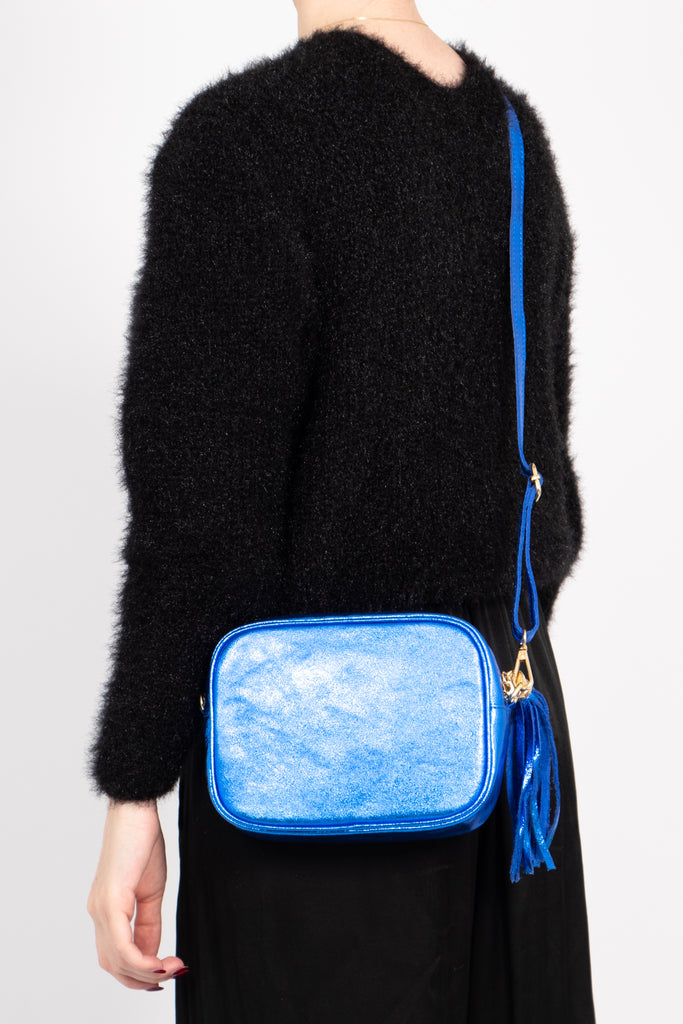 beau-italian-leather-crossbody-bag-blue-metallic-worn-by-model