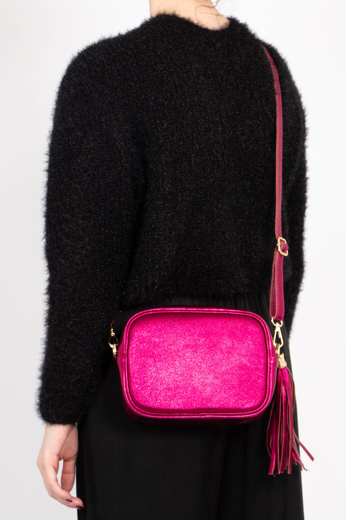 close up of the tassel detail on the crossbody camera bag