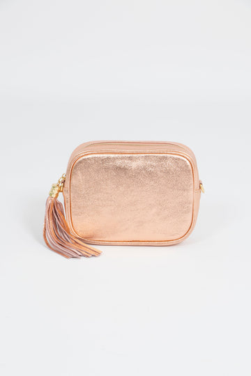 metallic shimmery rose gold leather crossbody camera bag with matching detachable bag strap