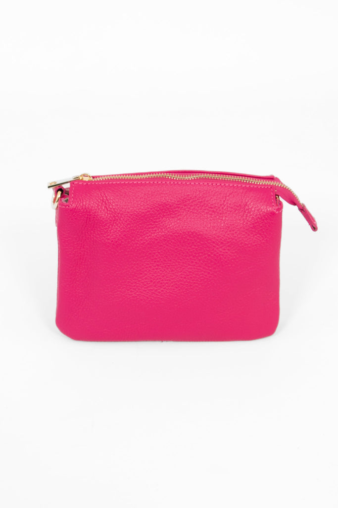 raspberry pink pebbled leather crossbody bag with zip closure 