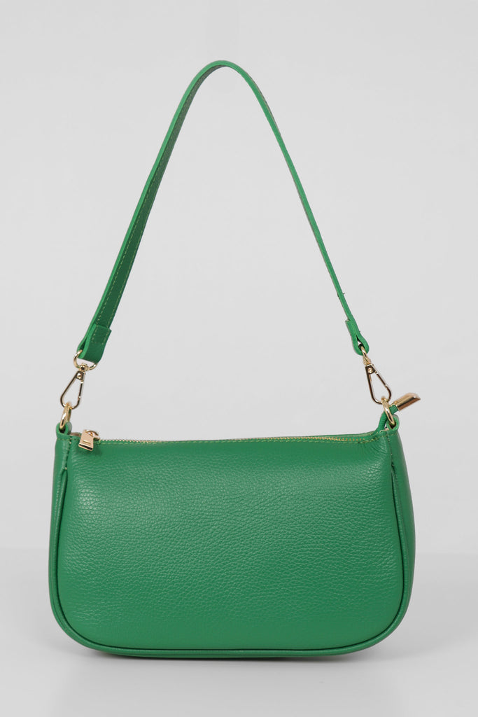 green leather baguette clutch bag with a detachable strap