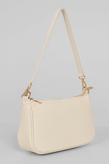 cream coloured leather baguette bag with detachable strap and zip closure