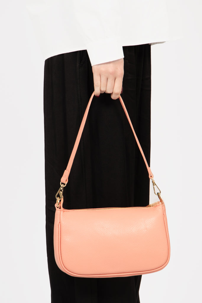 chloe-italian-leather-baguette-bag-salmon-pink-pebbled-held-by-model