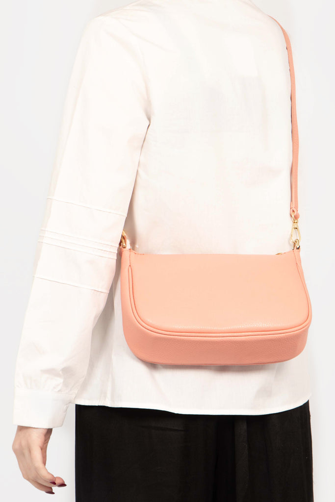 chloe-italian-leather-baguette-bag-salmon-pink-pebbled-worn-by-model-crossbody