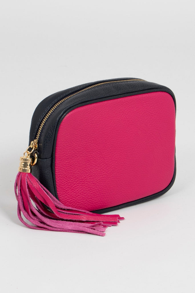 side view, pink front and back, pink tassle, navy blue around the sides of this leather camera bag