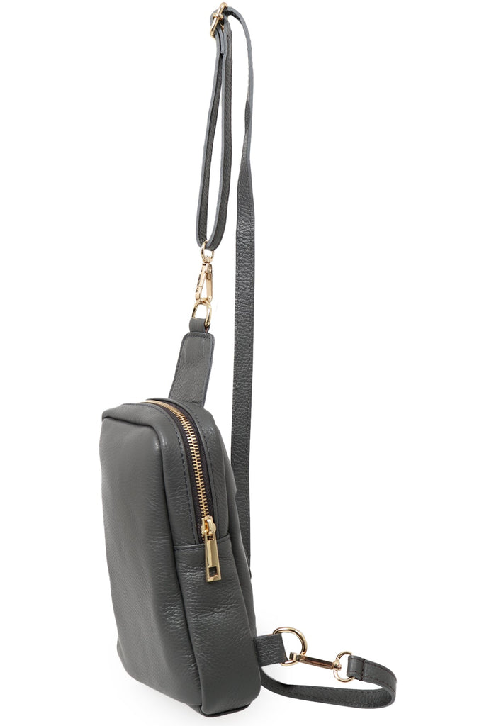 side view showing the zip closure of the leather sling bag