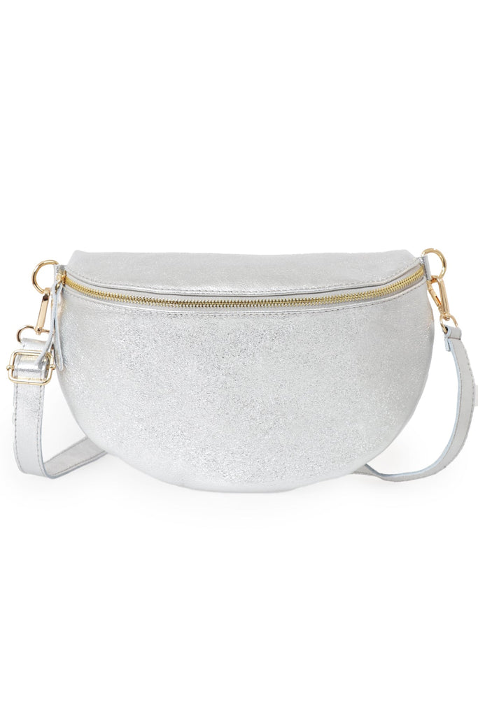 close up of the silver metallic leather bag, showing clearly the zip closure and adjustable strap