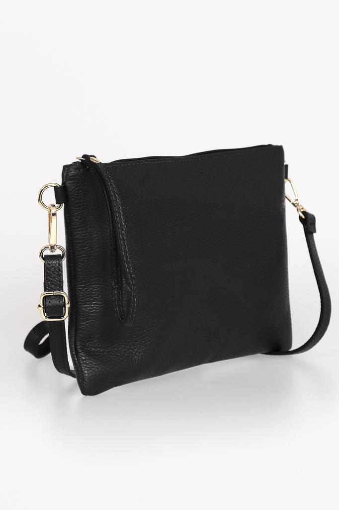 side view of the black leather wristlet clutch bag, showing the included additional long bag strap