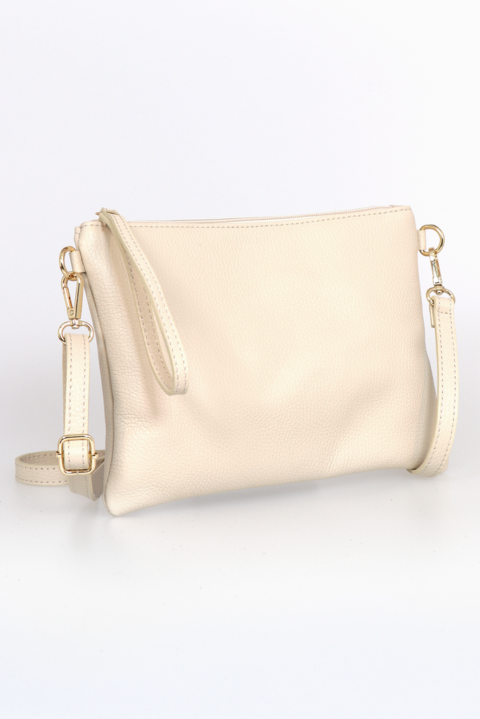 side view of the cream coloured wristlet clutch bag showing the additional long shoulder strap included