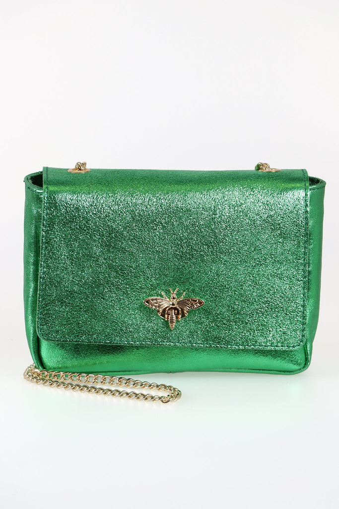 green metallic shimmery cross body bag with a gold chain strap and gold bee clasp on the front