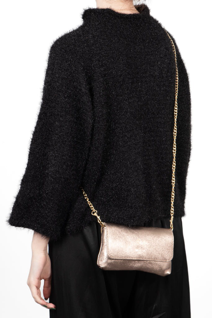 olga-italian-leather-mini-crossbody-bag-champagne-metallic-worn-by-model-chain-strap