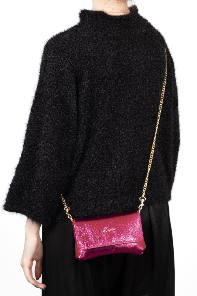 olga-metallic-italian-leather-mini-crossbody-bag-magenta-worn-by-model
