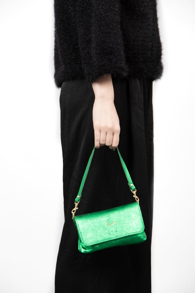 olga-metallic-italian-leather-mini-crossbody-bag-bright-green-carried-by-model