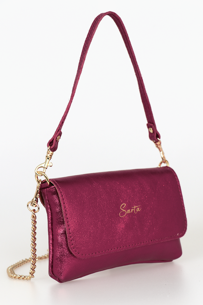 side view showing the shimmery pink leather and the gold sarta logo