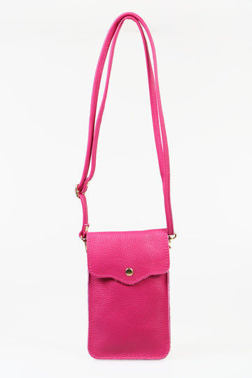 pink pebbled leather phone bag with an adjustable strap