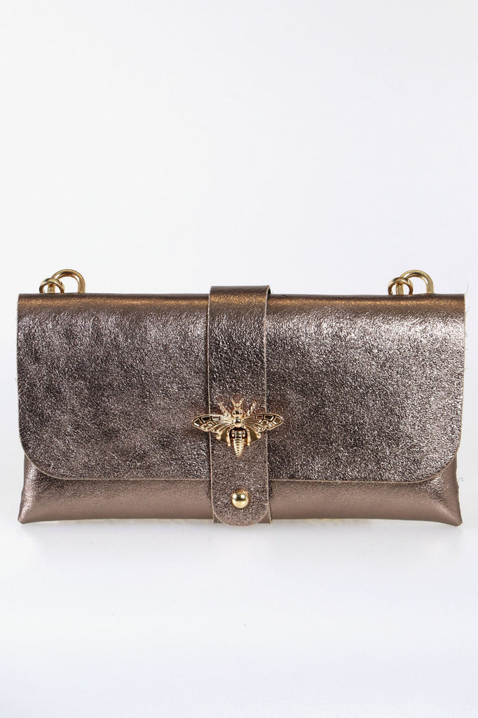 champagne rose gold shimmery clutch bag with a long detachable gold chain strap