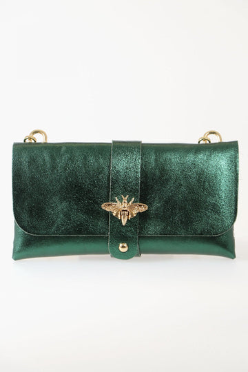 emerald green clutch bag with gold bee clasp on the front and a long detachable gold chain strap