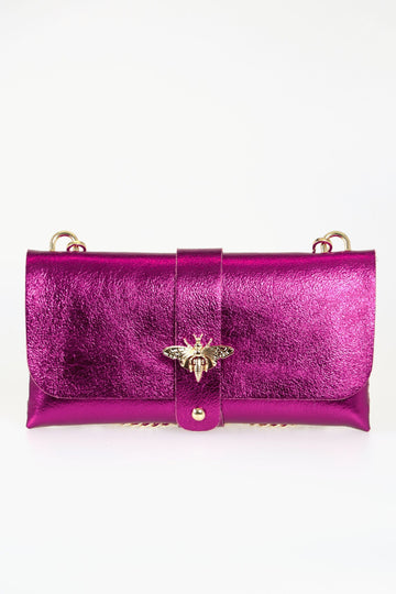 metallic pink leather clutch bag with detachable gold chain strap and gold bee clasp on the front