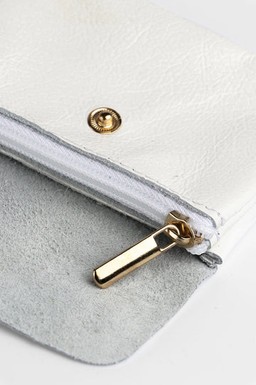 small white leather coin purse with an internal zip closure and outer snap button closure