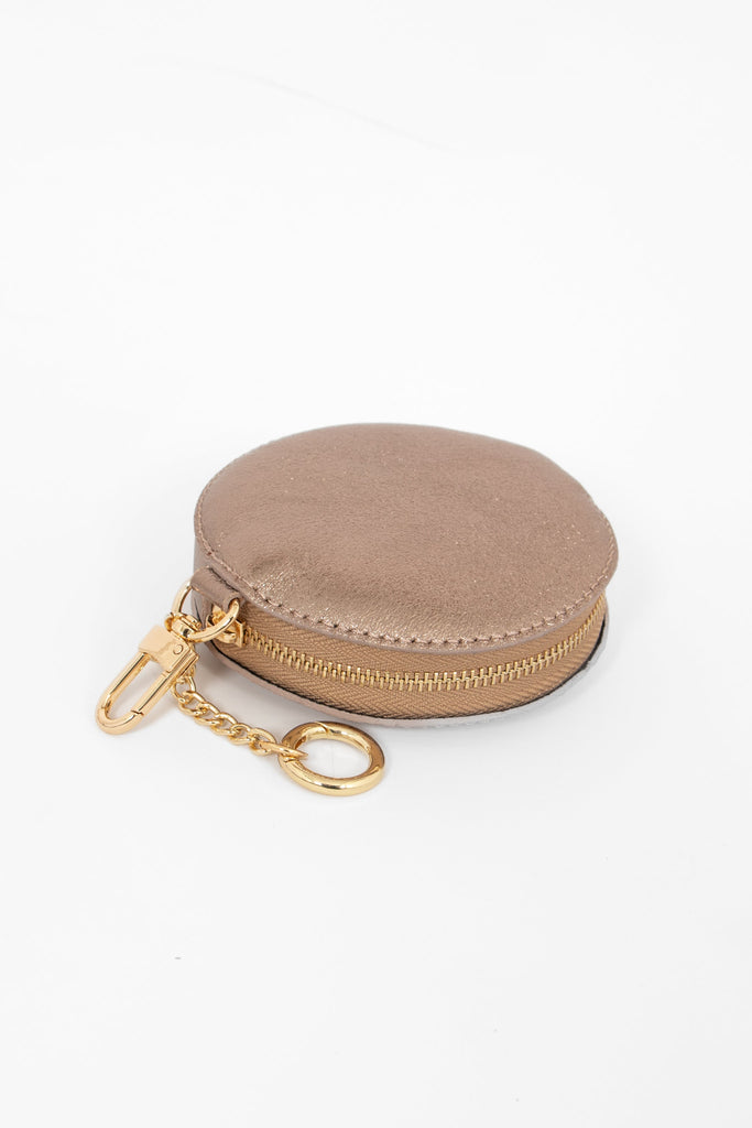 showing the zip closure of the coin purse