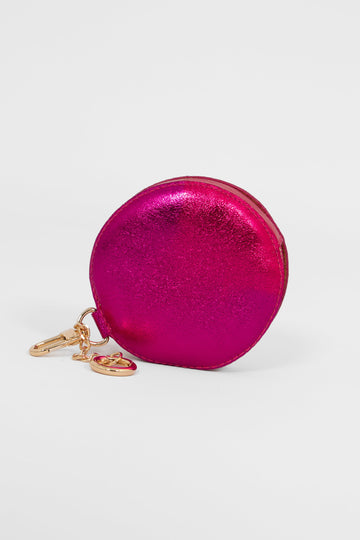 metallic pink round coin purse with a zip closure and two key ring attacments