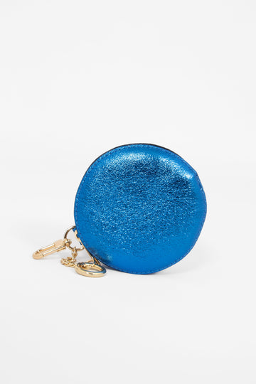 metallic blue round coin purse with a zip cloure and gold keyring attachments