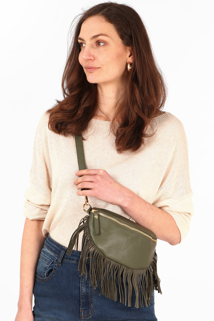close up of the khaki green leather half moon fringed bag