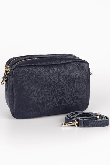 navy blue leather cross body camera bag with a matching detachable bag strap and two zip closing compartments