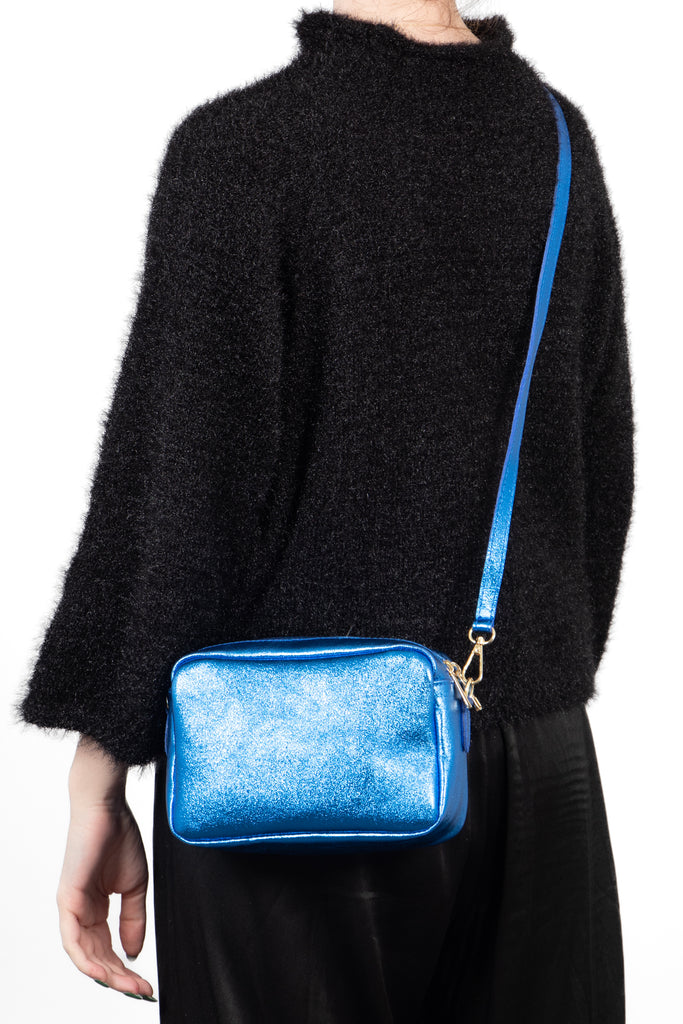 worn crossbody by model